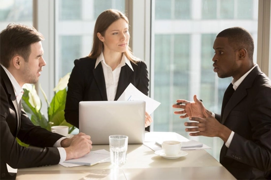 Image showing a customer service representative shaking hands with a client, symbolizing trust and reliability